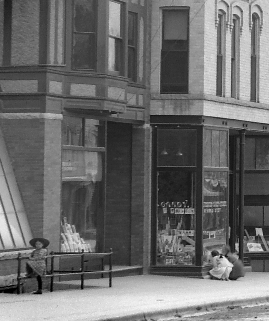Three girls in downtown Stoughton circa 1908